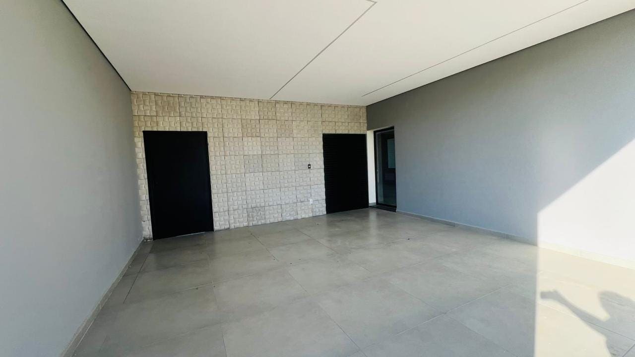 Espaço gourmet com parede de pedra